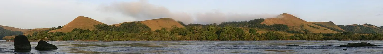 Stitched panoramic photograph of the savanna and forest of Lopé National Park